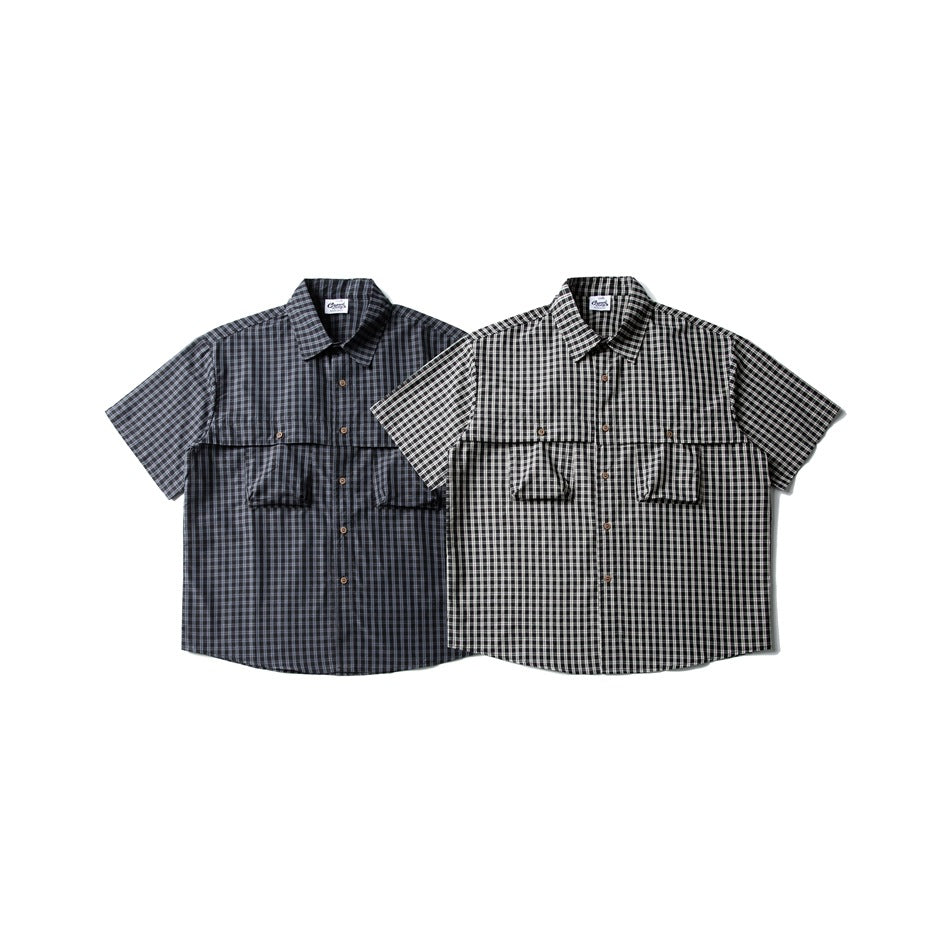 Two short-sleeve button-up shirts with plaid patterns in dark gray and black-and-white colorways.