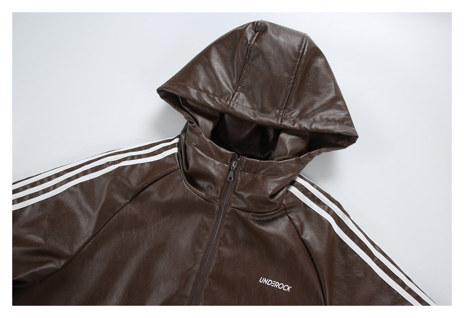 Close view of a brown hooded jacket with a front zipper, white sleeve stripes, and a small chest logo.