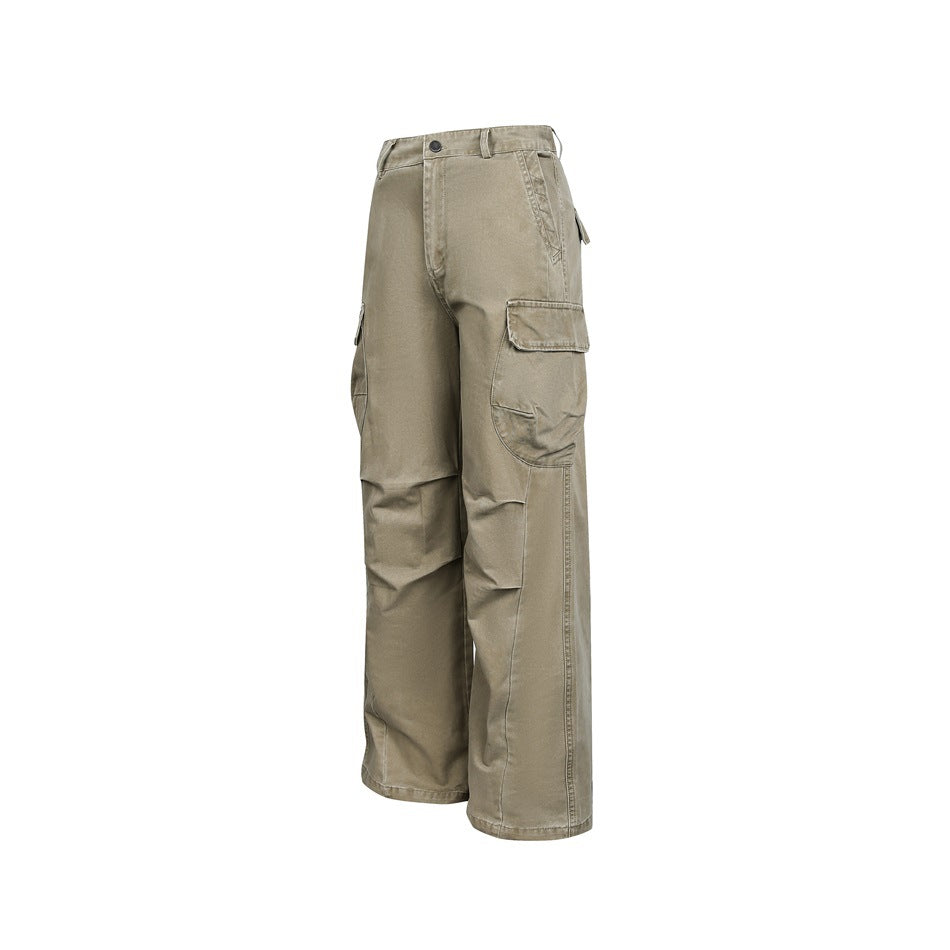 Front three-quarter view of light taupe wide-leg cargo pants with multiple flap pockets.