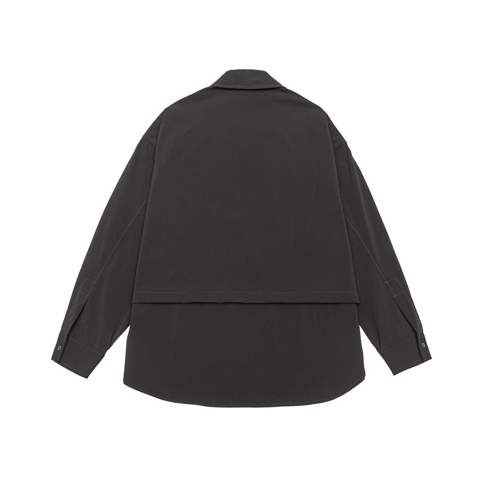 Back view of a dark charcoal shirt jacket with a pointed collar, long sleeves, and a layered back yoke.