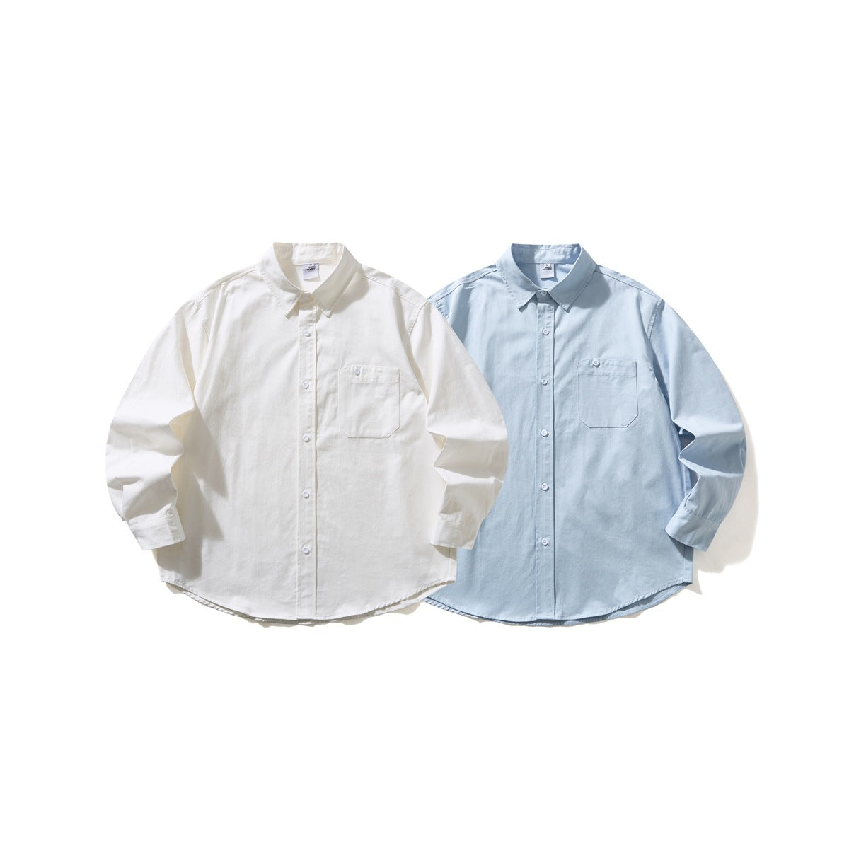 Two long-sleeved button-up shirts shown from the front, one white and one pale blue.