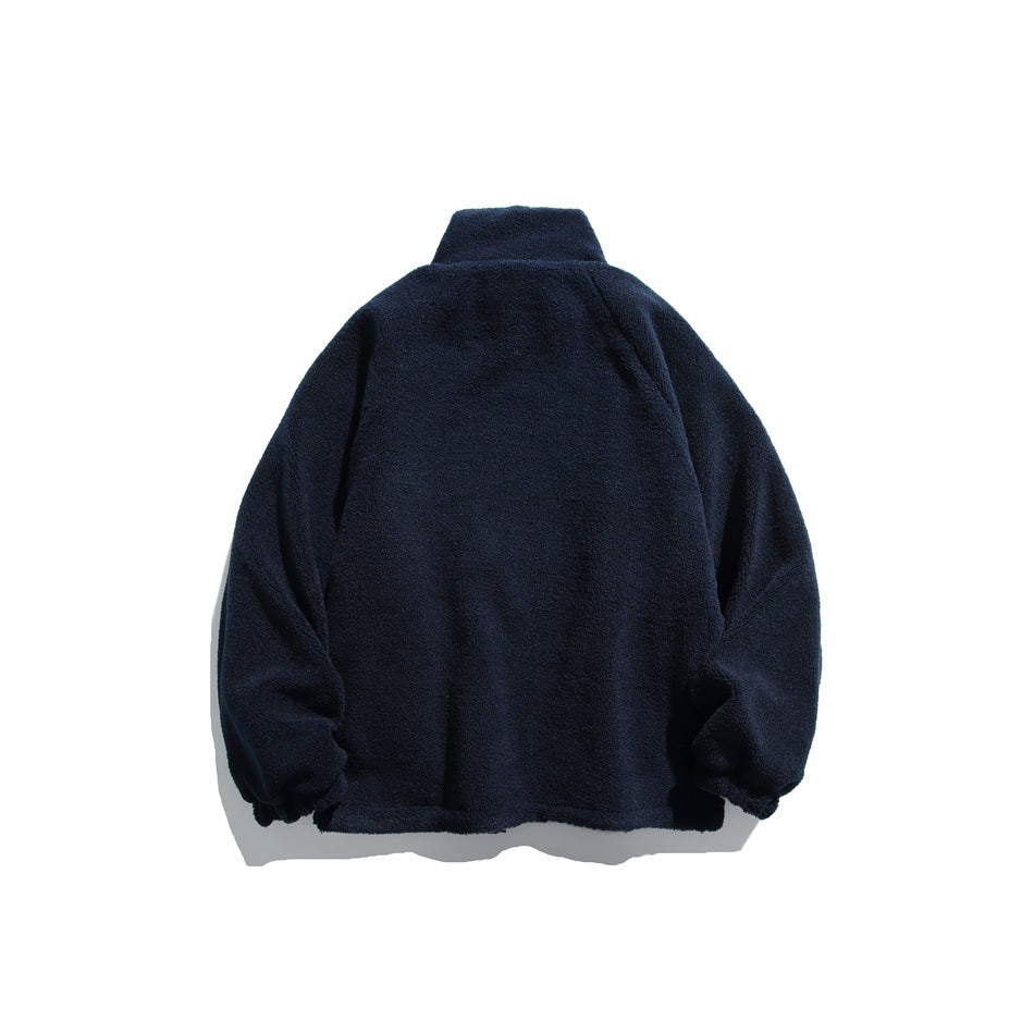 Back view of a solid navy fleece jacket with a high collar and gathered cuffs.