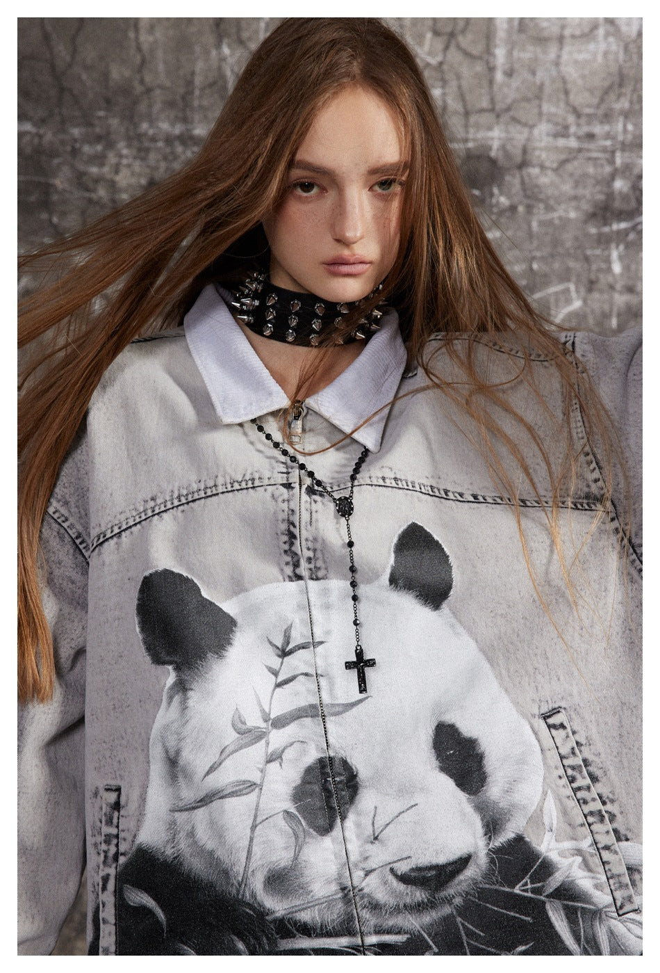 Close-up of a model wearing a light gray zip-front jacket with a large black-and-white panda print.