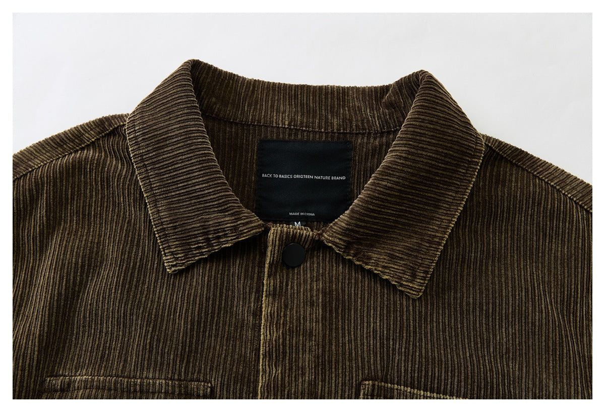 Close-up of the brown corduroy jacket collar, front snap, and sewn-in black neck label.