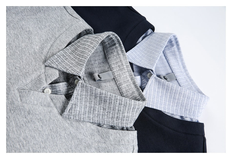 Layered gray, navy, and pale blue polo shirts show ribbed collars and button plackets.