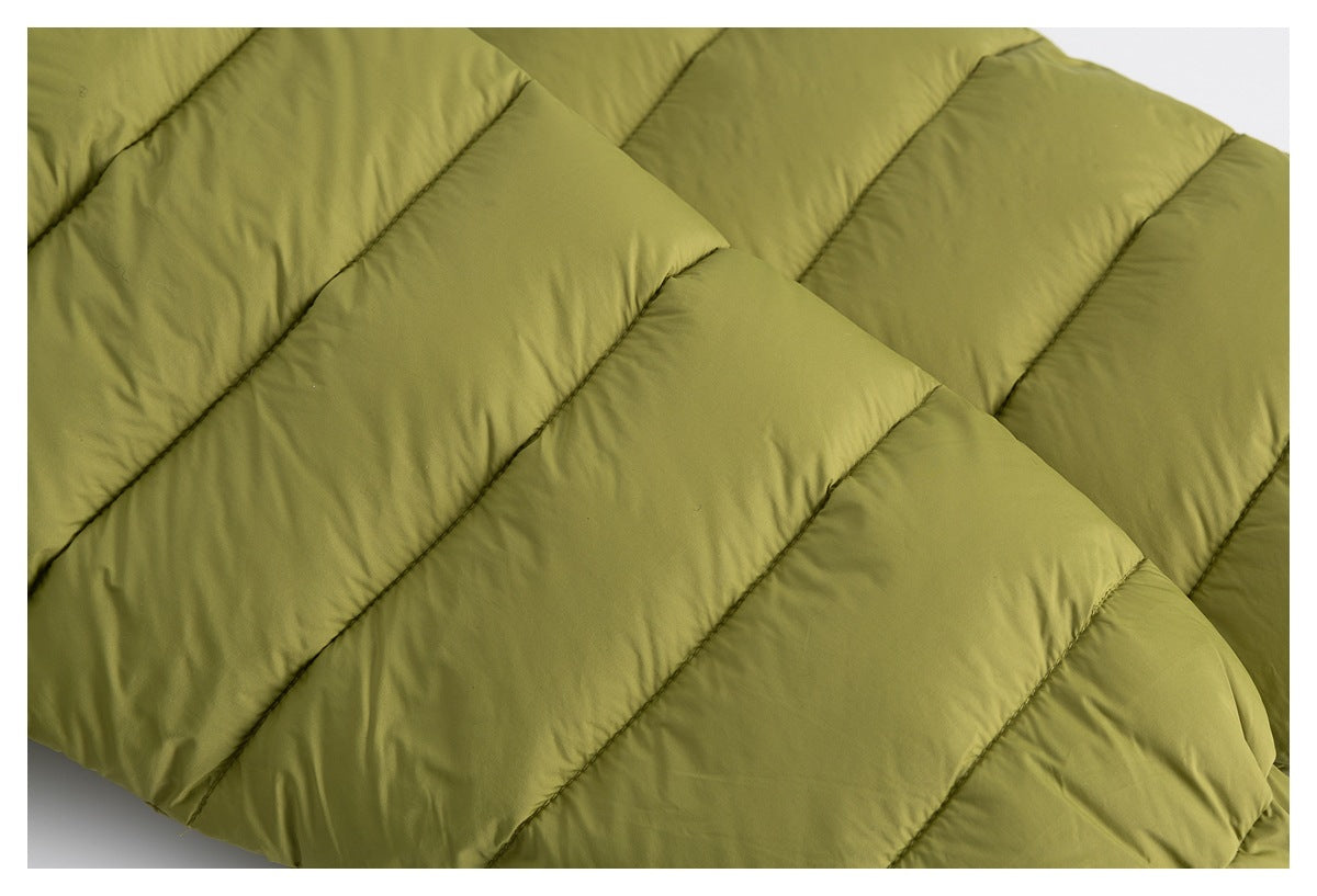 Close-up of intersecting quilted sections on an olive-green padded garment.
