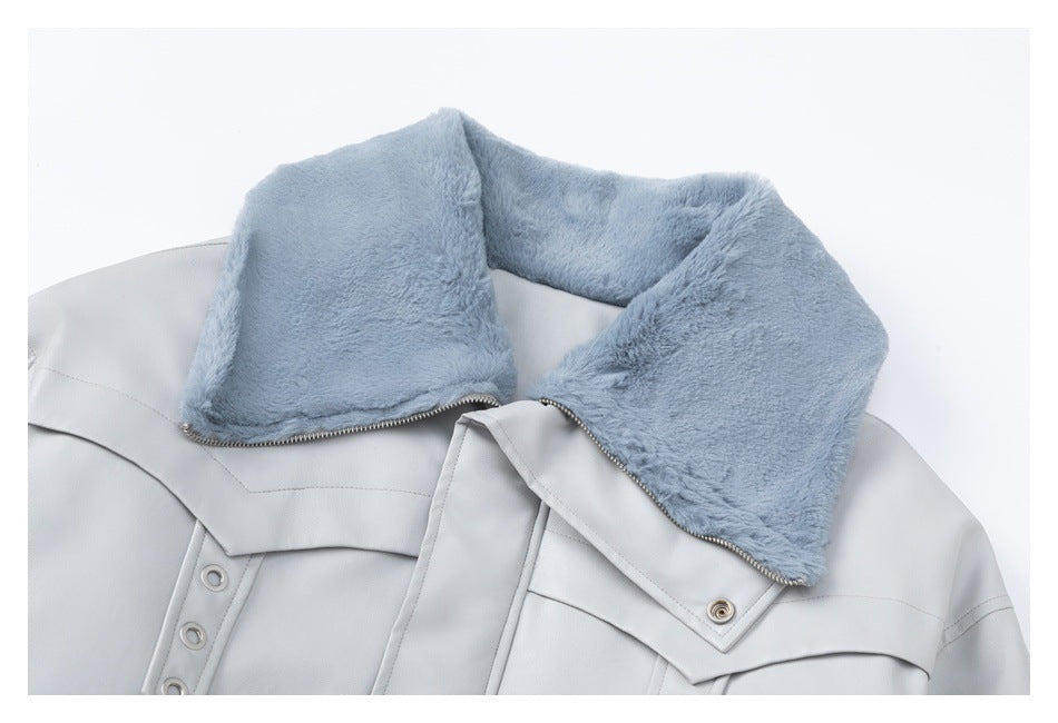 Pale gray jacket collar with a plush blue lining and metal zipper.