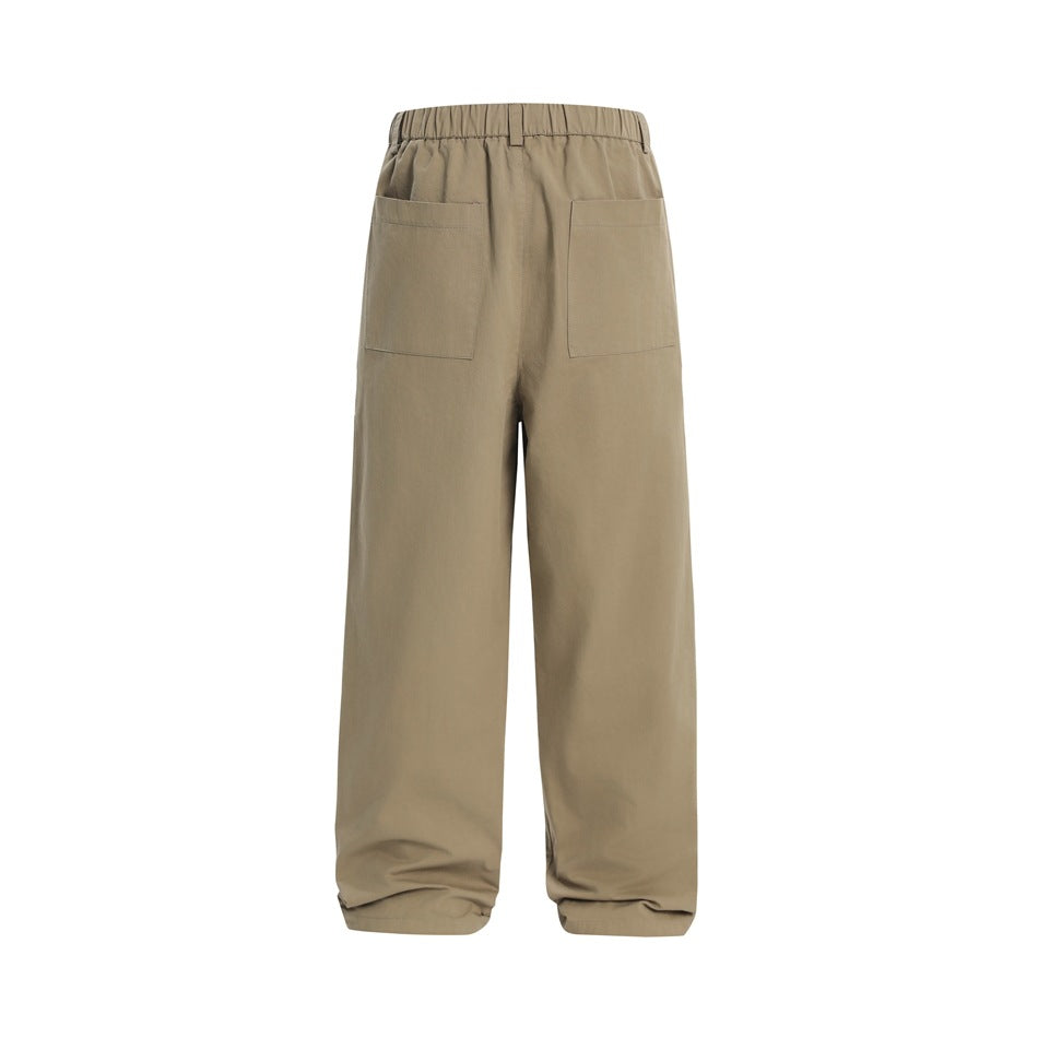 Back view of taupe wide-leg trousers with an elastic waistband and two patch pockets.
