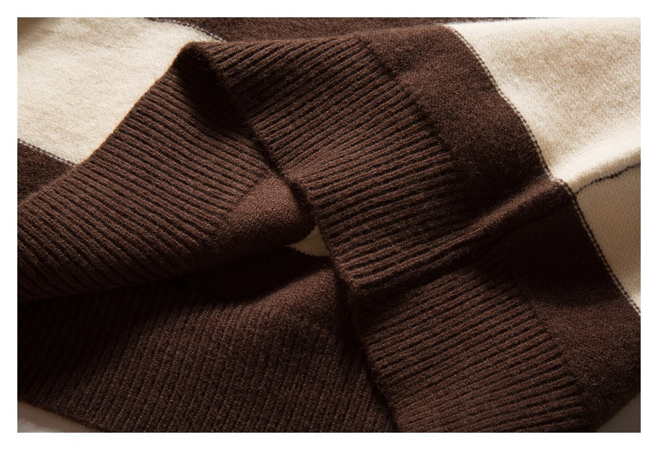 Close-up of overlapping dark brown ribbed knit cuffs against striped fabric.