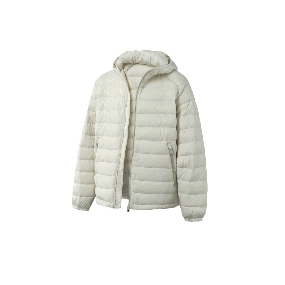 Ivory hooded puffer jacket shown from the front, with horizontal quilting, a front zipper and zip pockets.