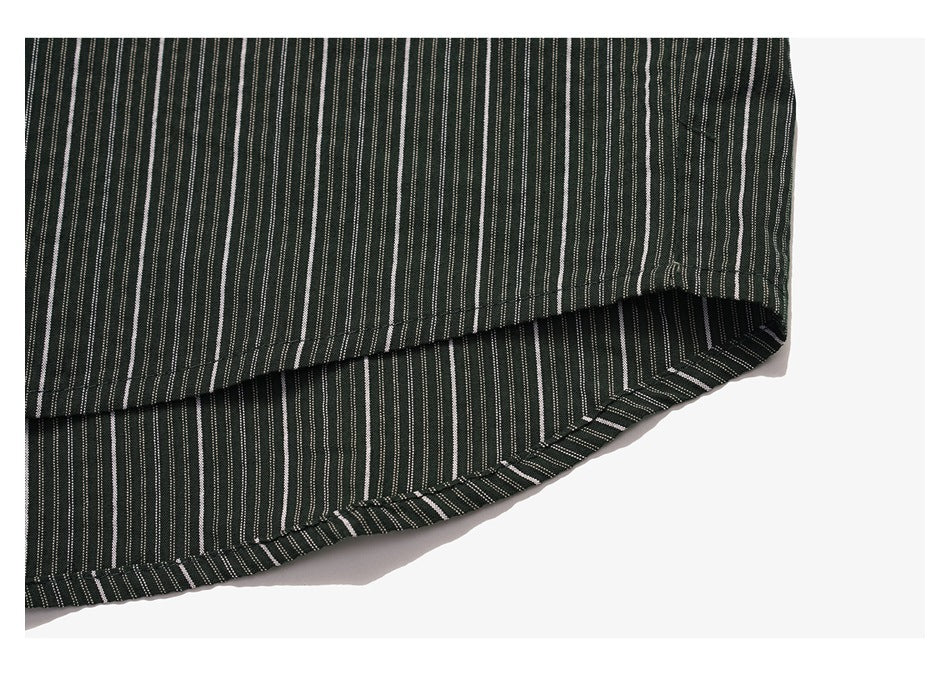 Close-up of a dark garment hem with narrow white vertical stripes and visible stitching.