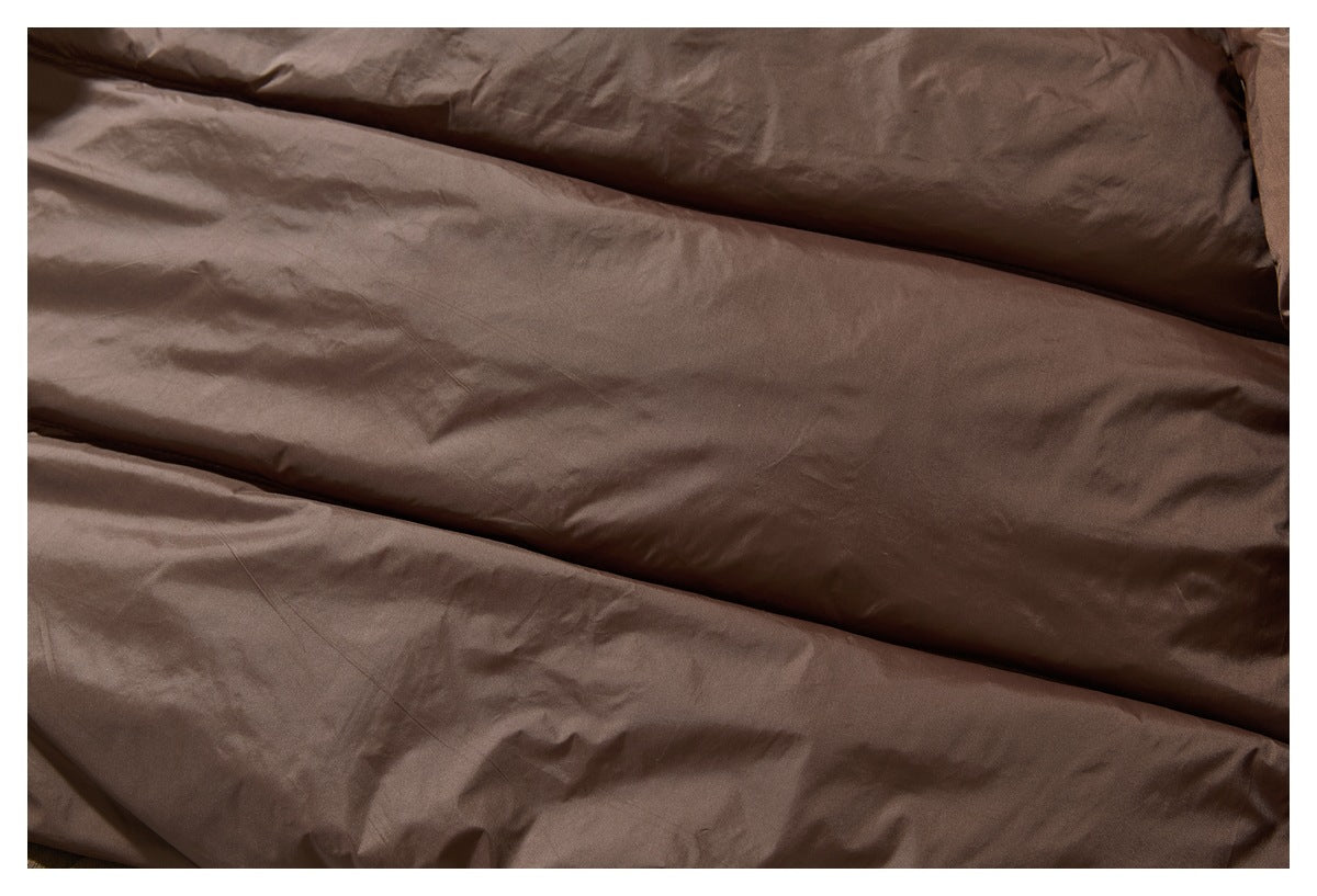 Close-up of the brown jacket's softly creased padded lining.