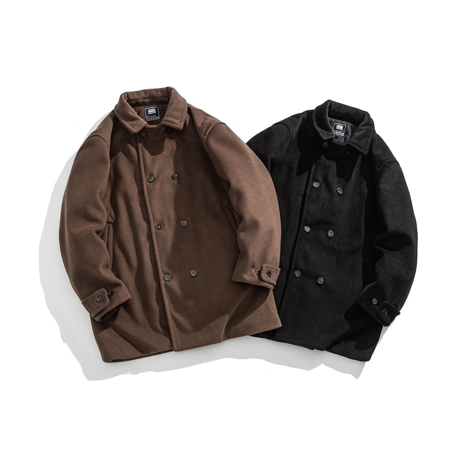 Brown and black double-breasted coats arranged side by side, showing their collars, buttons, and cuff tabs.