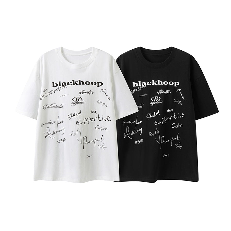 White and black short-sleeve crew-neck T-shirts with assorted text graphics across the front.