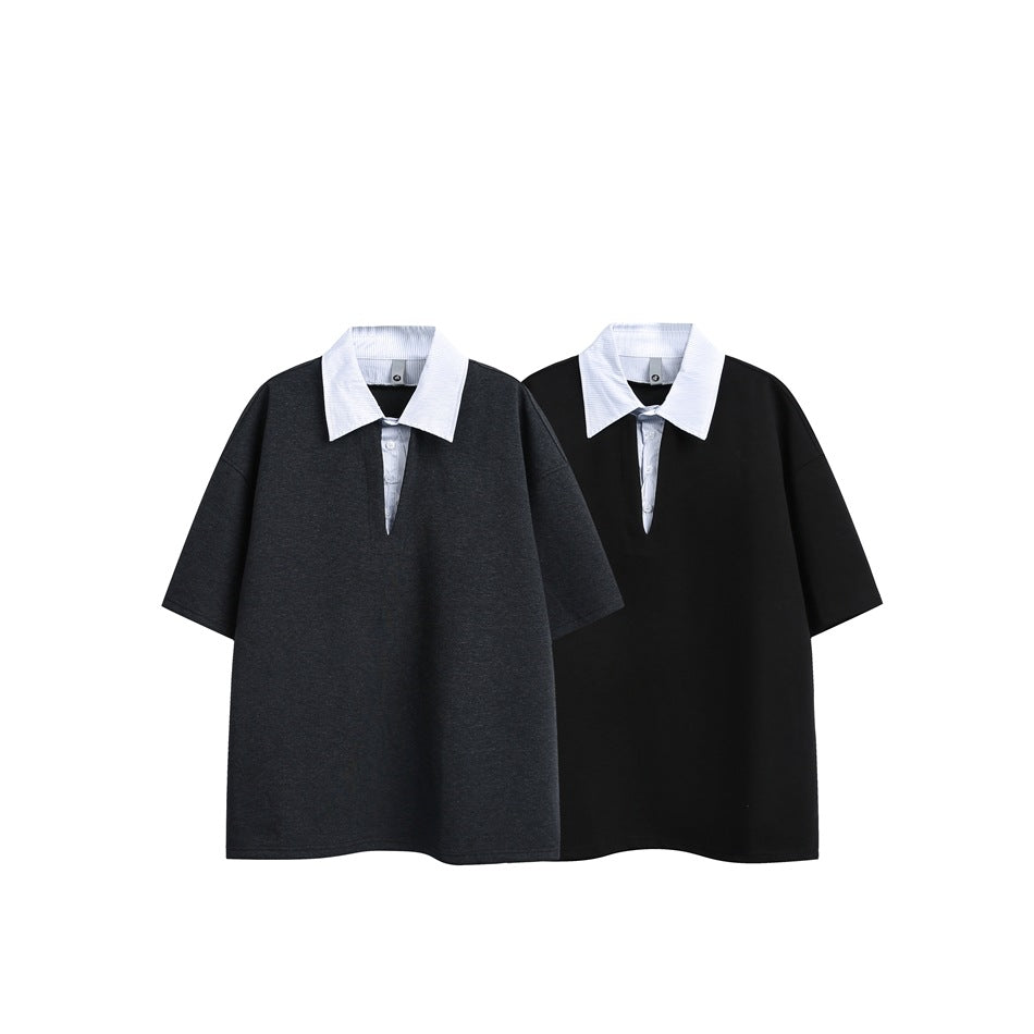 Two short-sleeve collared shirts shown together: one charcoal and one black, both with white collars and button plackets.