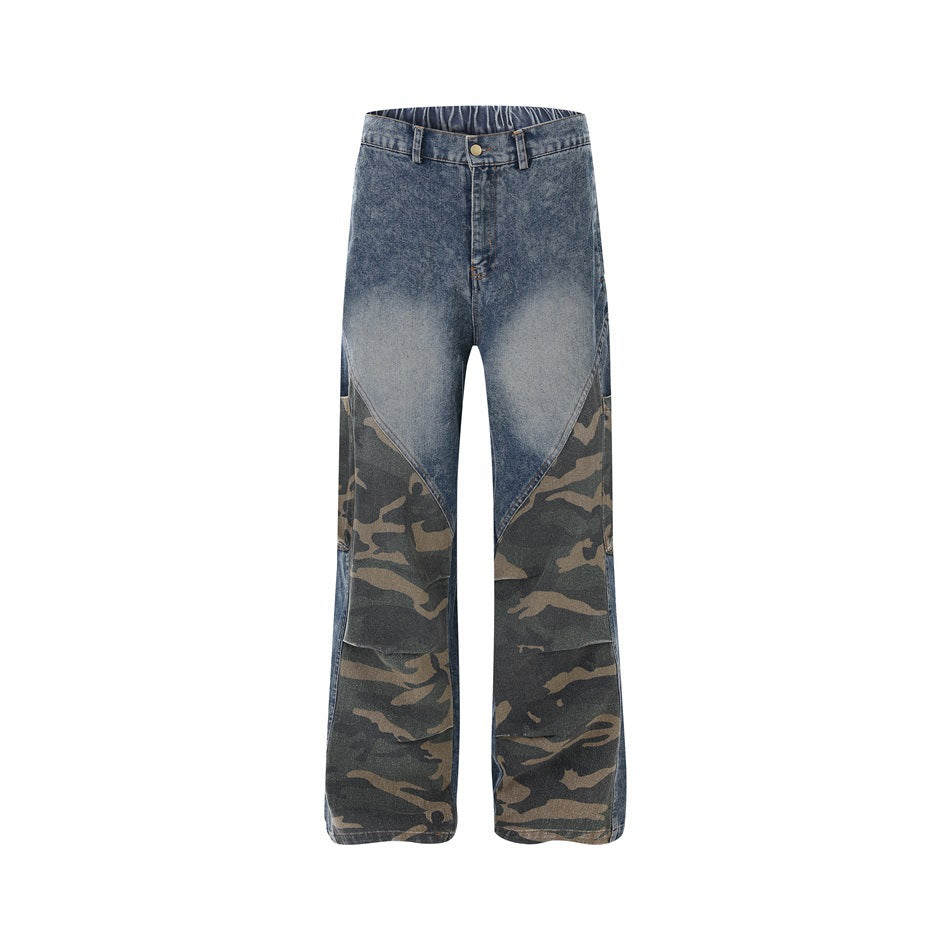 Front view of wide-leg faded blue jeans with dark camouflage panels across the lower legs.