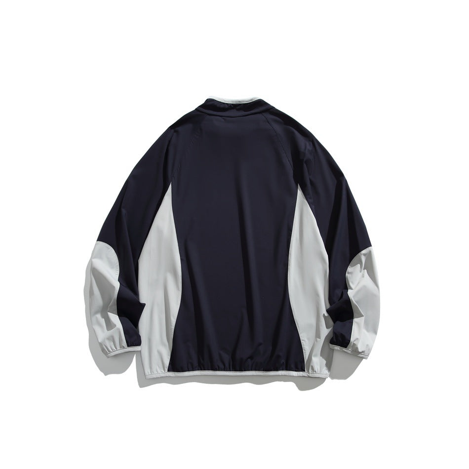Navy pullover back view with light gray side panels and lower sleeves, gathered hem and cuffs, flat lay