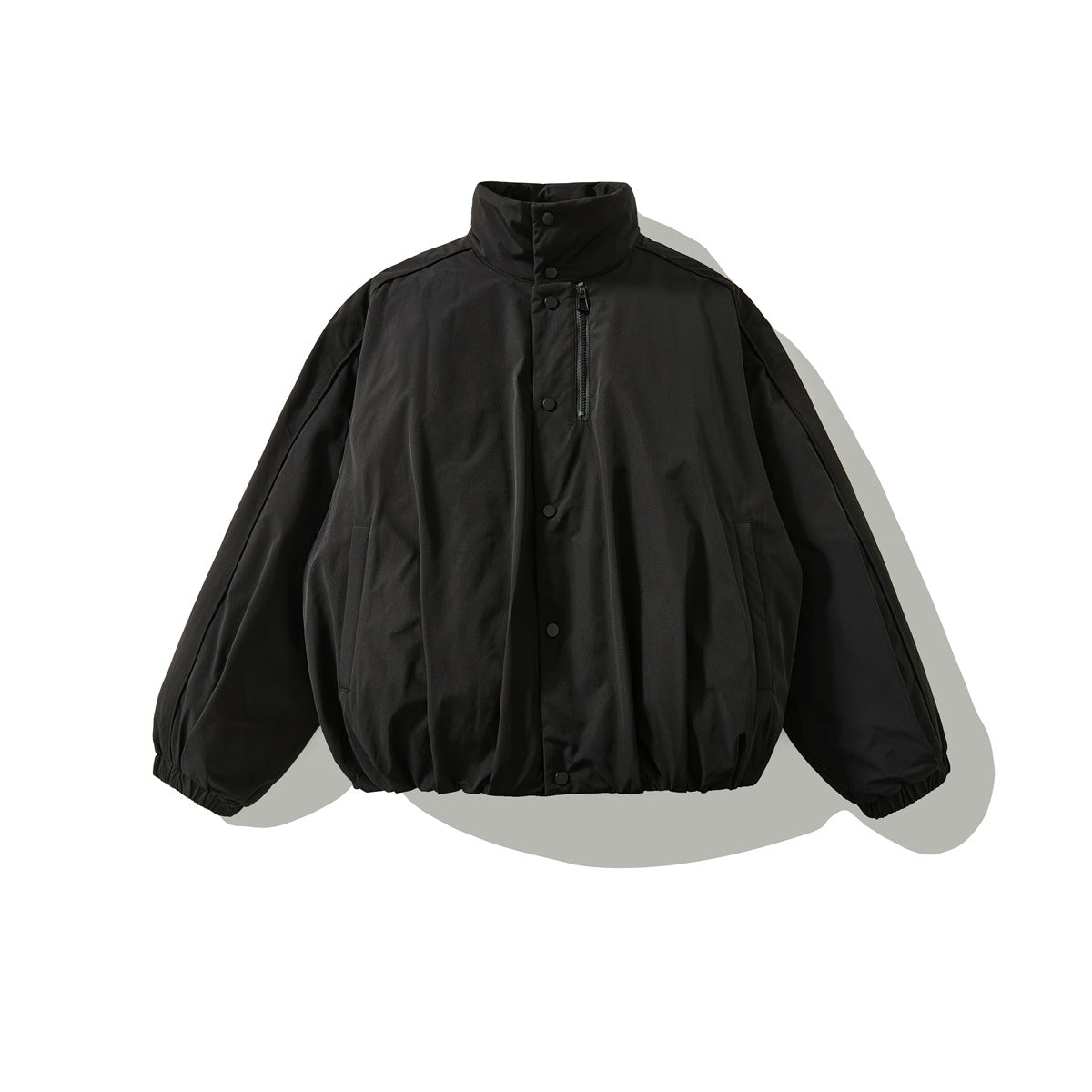 Black stand-collar puffy jacket flat lay with snap placket, chest zip pocket and elastic cuffs