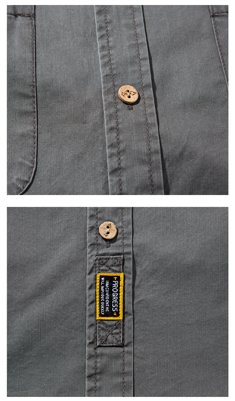 Close-up of the charcoal gray shirt's wooden buttons, stitching, and sewn black-and-yellow placket label.