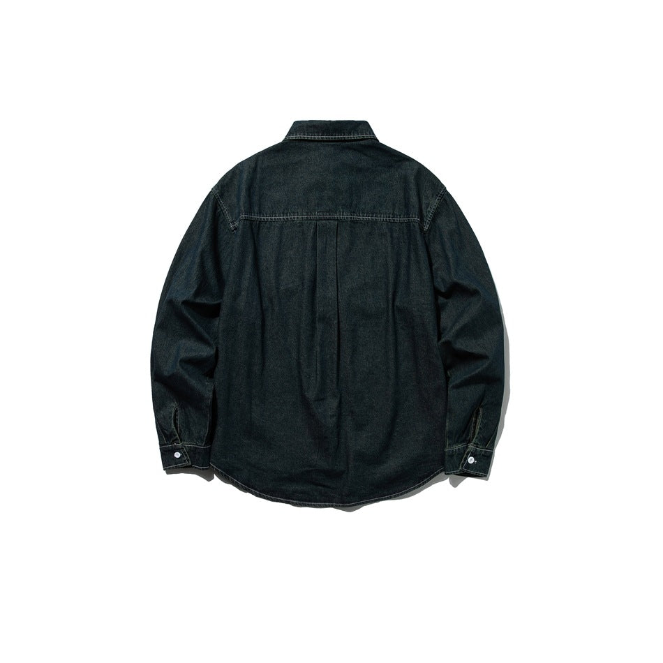 Back view of dark denim shirt showing yoke, center pleat and buttoned cuffs