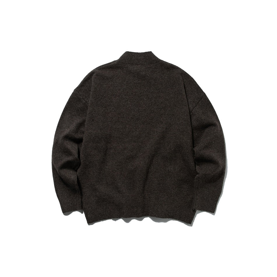 Back view of a dark brown mock-neck sweater laid flat on a white background.