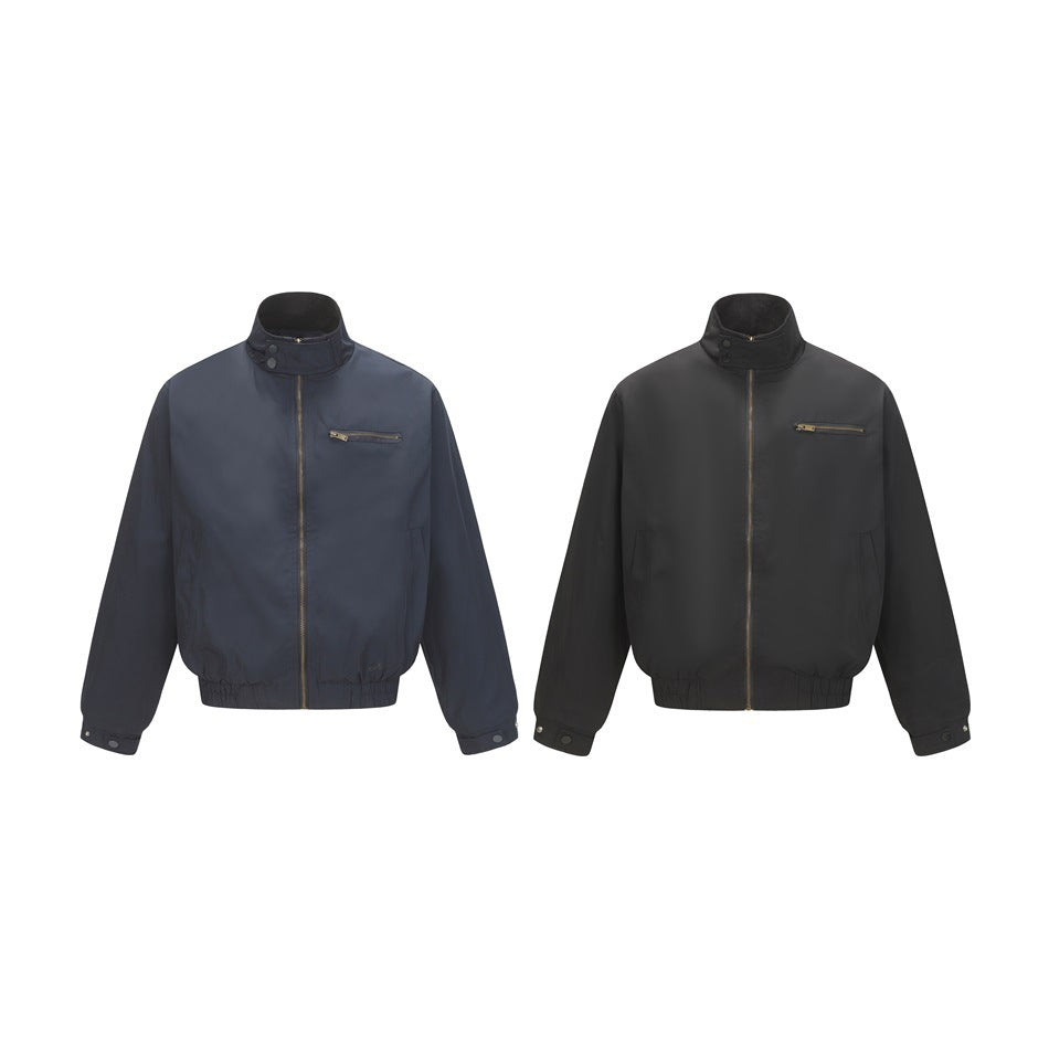 Two jacket colorways shown side by side: navy and black, both with zip fronts and chest pockets.