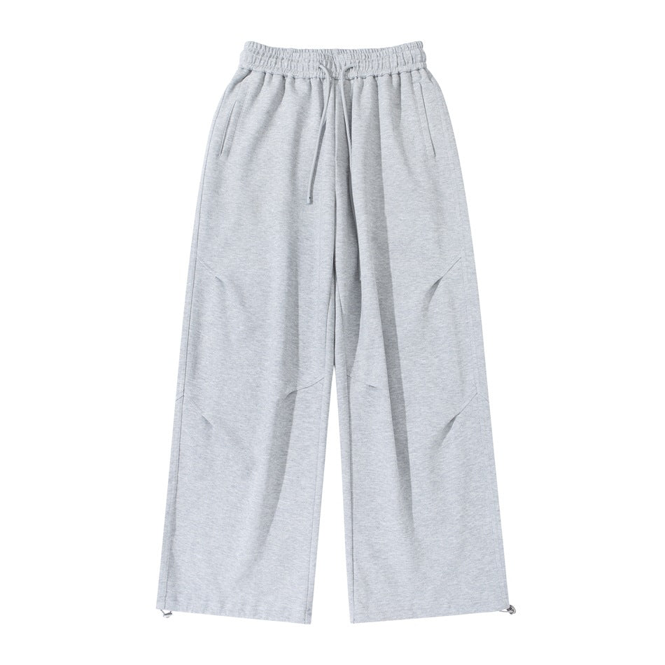 Light heather gray wide-leg sweatpants flat lay, front view, with drawstring waist and toggle hems