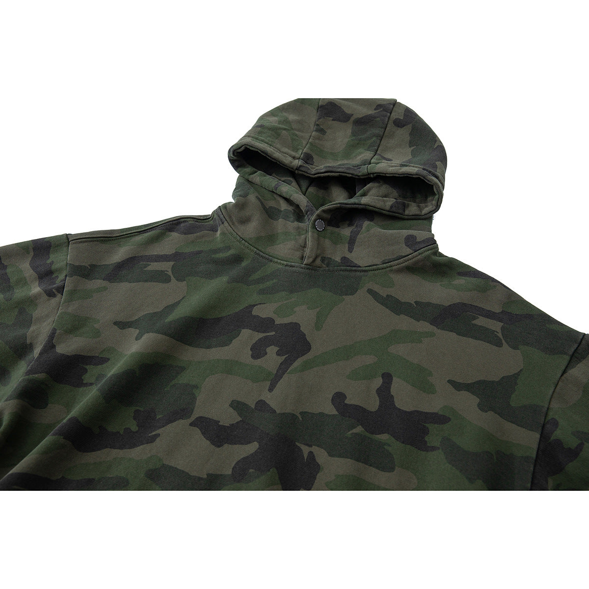 Close-up of a green woodland camouflage hoodie showing the hood, snap-button neckline and upper front.
