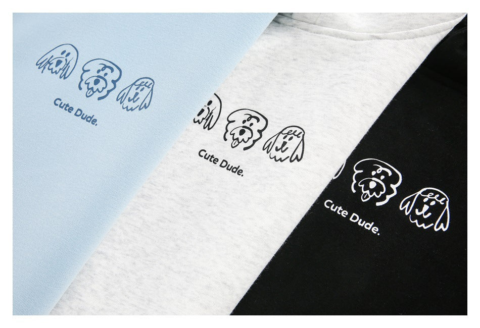 Light blue, heather gray, and black hoodies show small cartoon faces and the words “Cute Dude.”