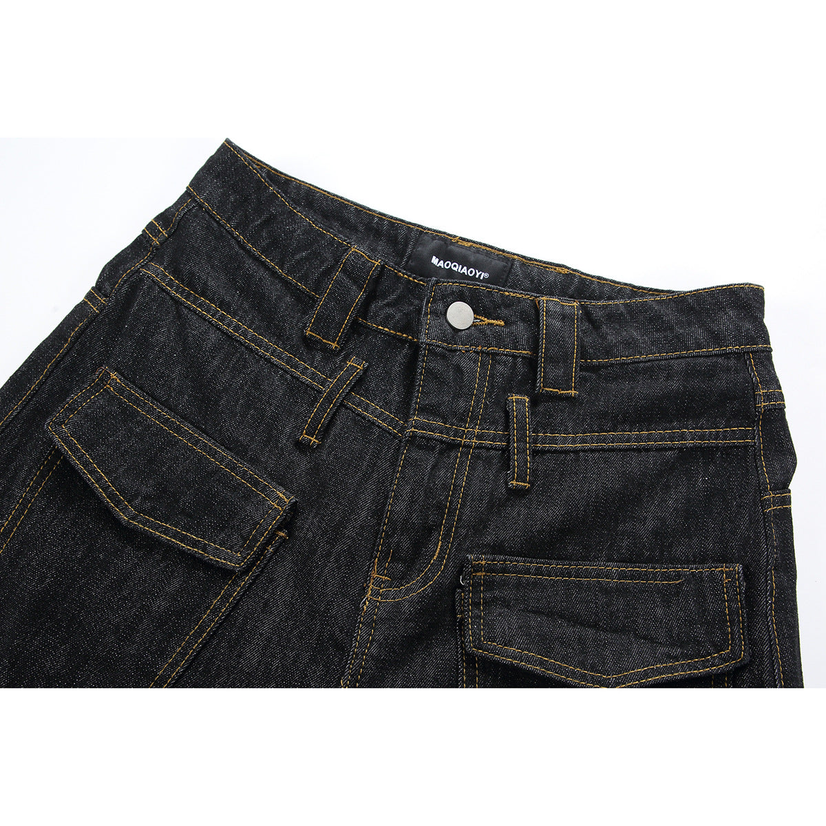 Close-up of black denim jeans showing the waistband, button, belt loops, pockets, and contrast stitching.