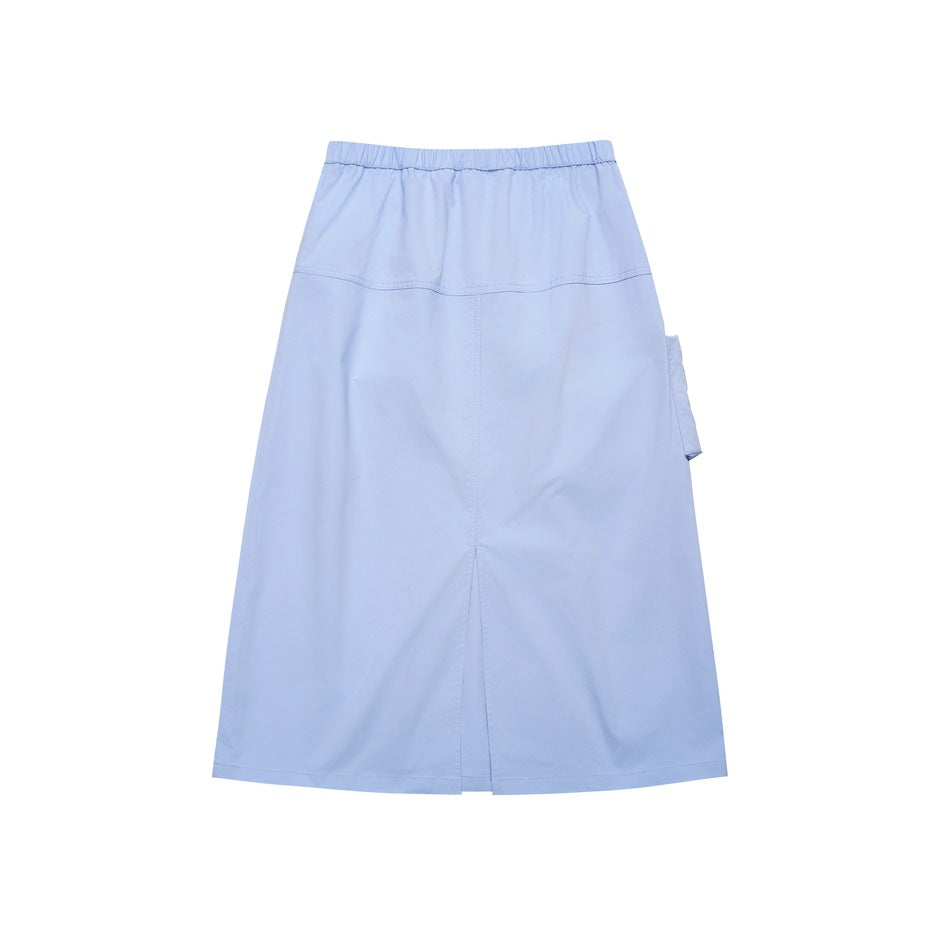 Full view of a light blue ankle-length skirt with an elastic waistband, panel seams, side pocket and center slit.