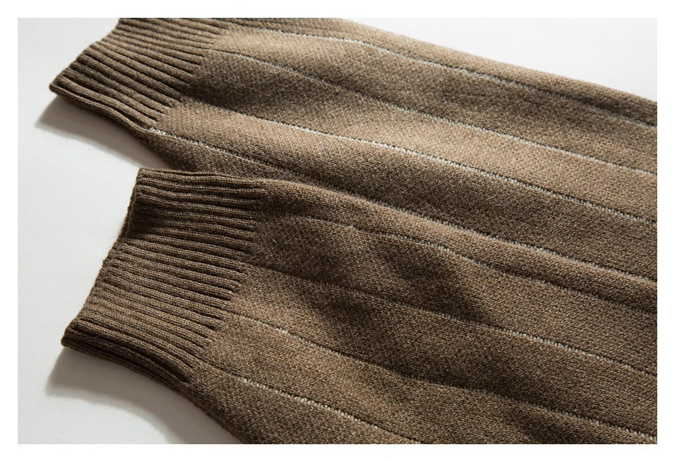 Close-up of two ribbed cuffs on a brown cardigan with narrow light stripes.
