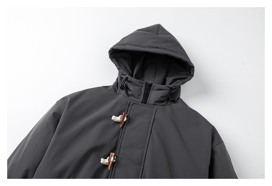 Close view of the charcoal jacket's hood, high collar, zipper, and wooden toggle fasteners.