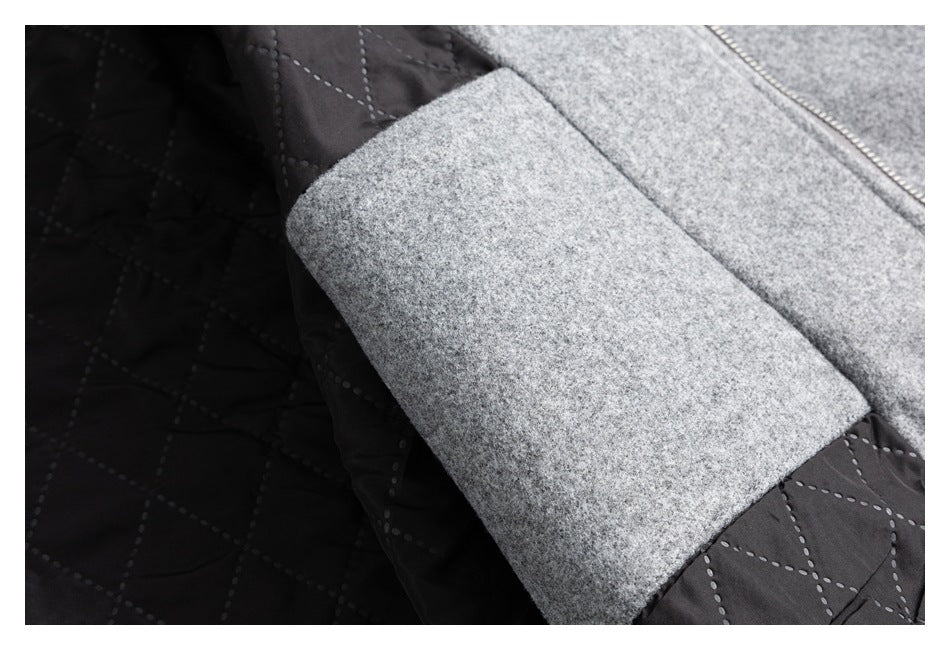 Close-up of the coat's gray outer fabric and black diamond-quilted lining.