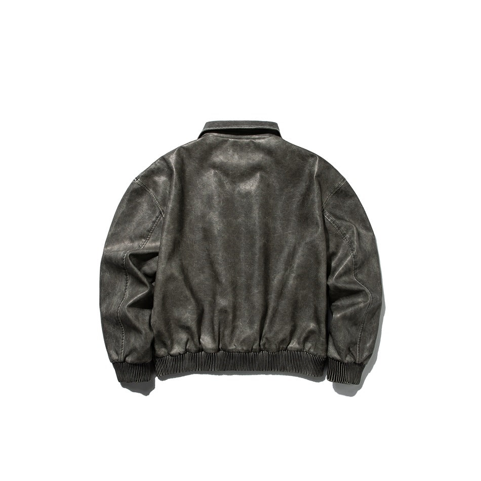 Back view of a charcoal-gray jacket with a plain body, seam detailing, and ribbed cuffs and hem.