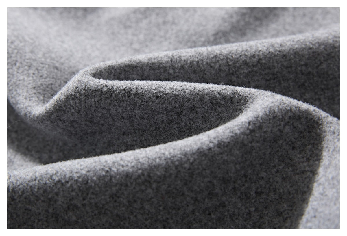 Close-up of the soft-looking heather gray fabric with gently folded contours.