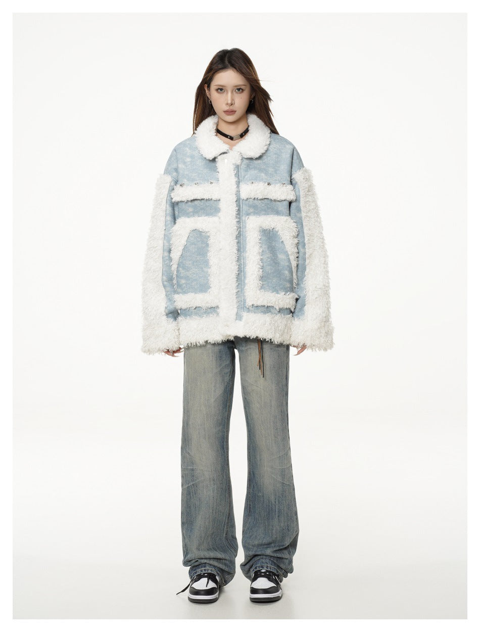 Full-length front view of a model wearing a light blue jacket with white shaggy trim and loose blue jeans.