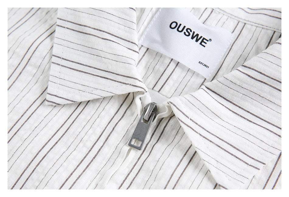 Close-up of the striped shirt's collar, metal zipper and sewn-in OUSWE label.