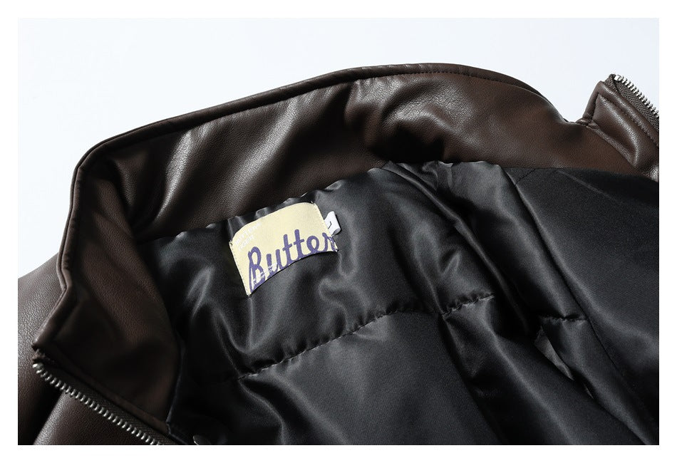 Close-up of the jacket's black quilted lining and an attached English-text label.