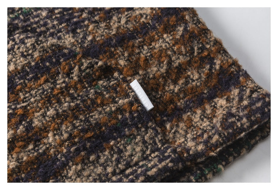 Close-up of patterned fabric with a small white tag near the edge.