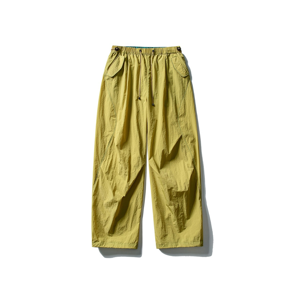 Chartreuse yellow wide-leg pants with drawstring waist and flap pockets, flat lay front view