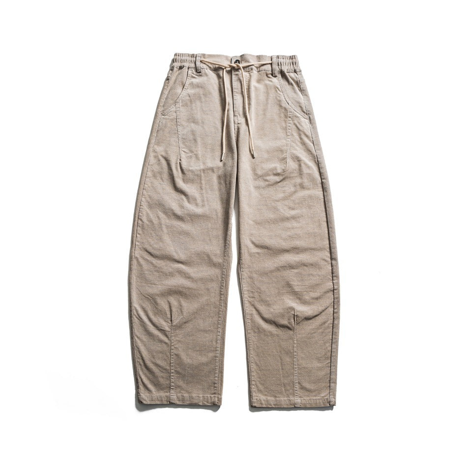 Flat-lay front view of beige wide-leg drawstring pants with elastic waistband and curved panel seams