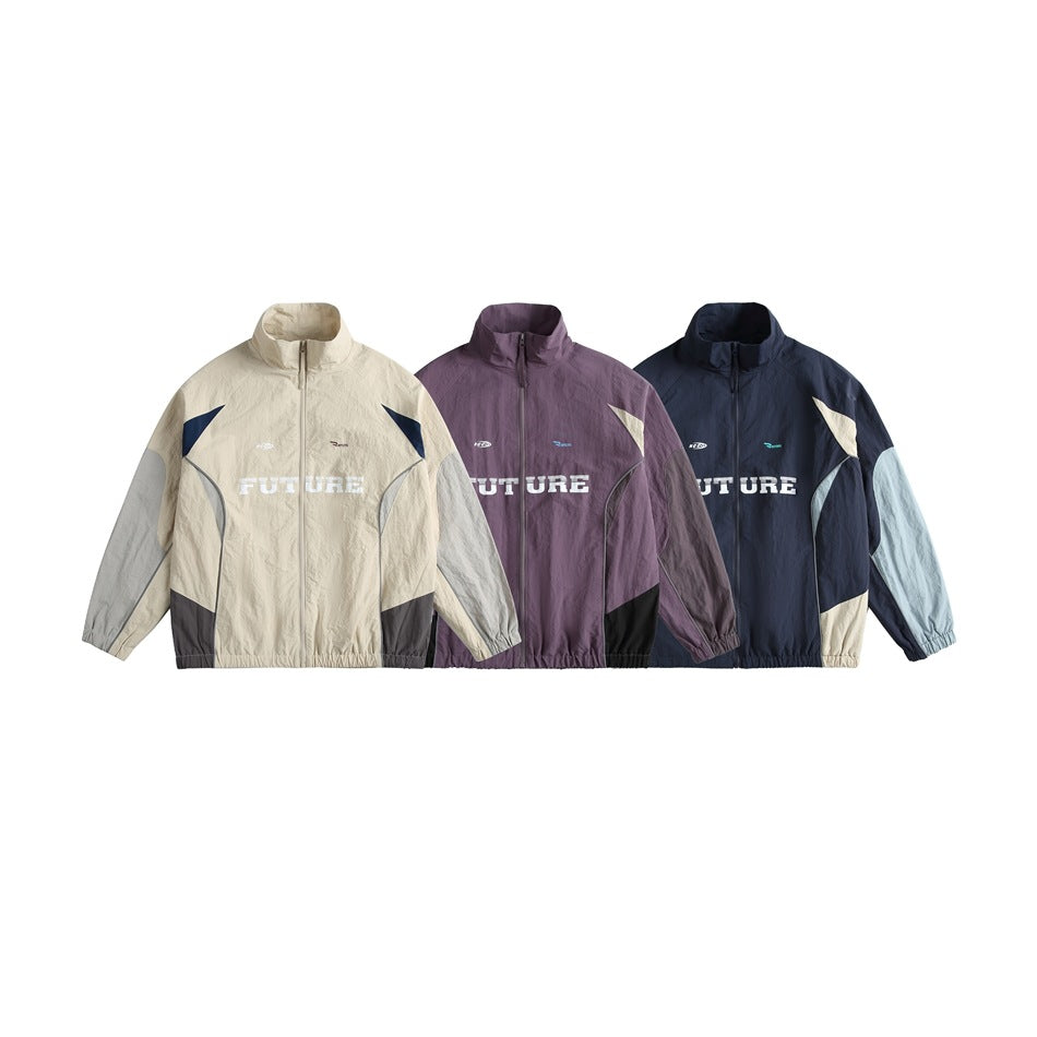 Three colorways of a high-collar zip jacket shown from the front: cream, plum, and navy with contrasting panels.