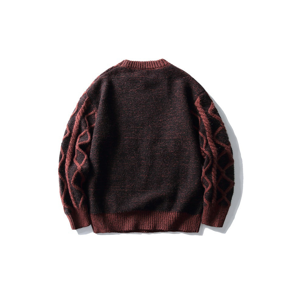 Back view of a burgundy and black sweater with raised cable-knit sleeves and ribbed trim.