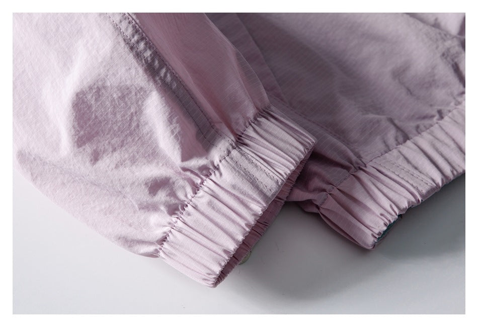 Close-up of a pale lavender jacket sleeve with a gathered elastic cuff.