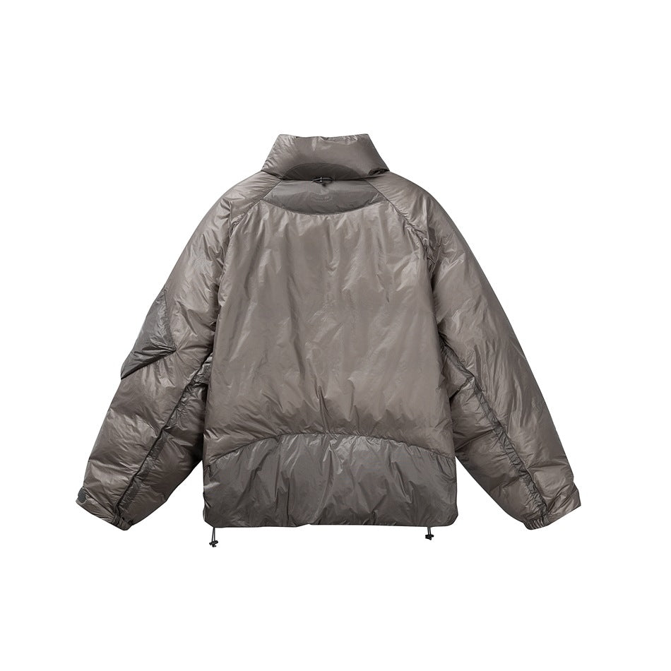 Back view of a gray-taupe puffer jacket with a high collar, curved paneling, and adjustable hem.