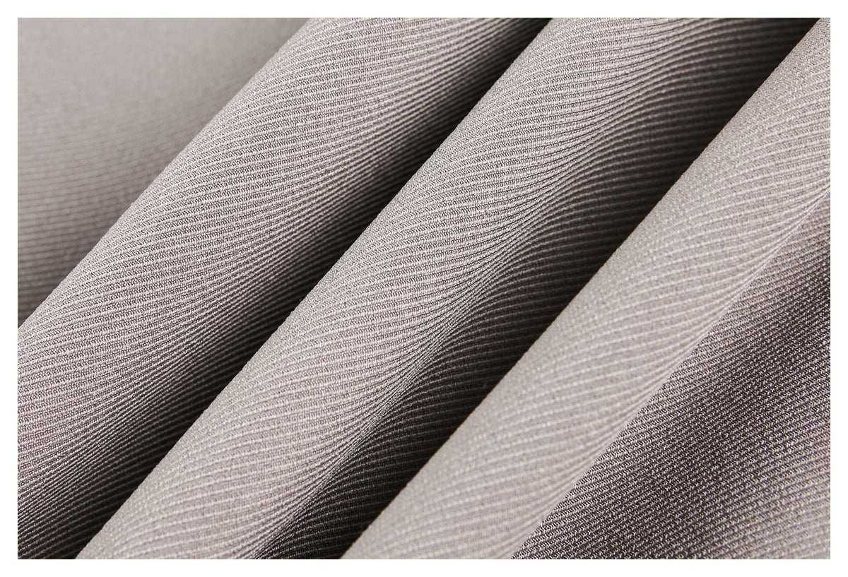 Close-up of folded gray-taupe fabric with a fine, closely spaced ribbed texture.