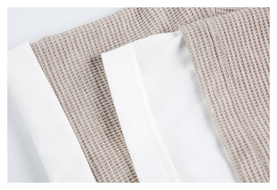 Close-up of the inside of the beige textured top, showing white inner fabric and stitched edges.