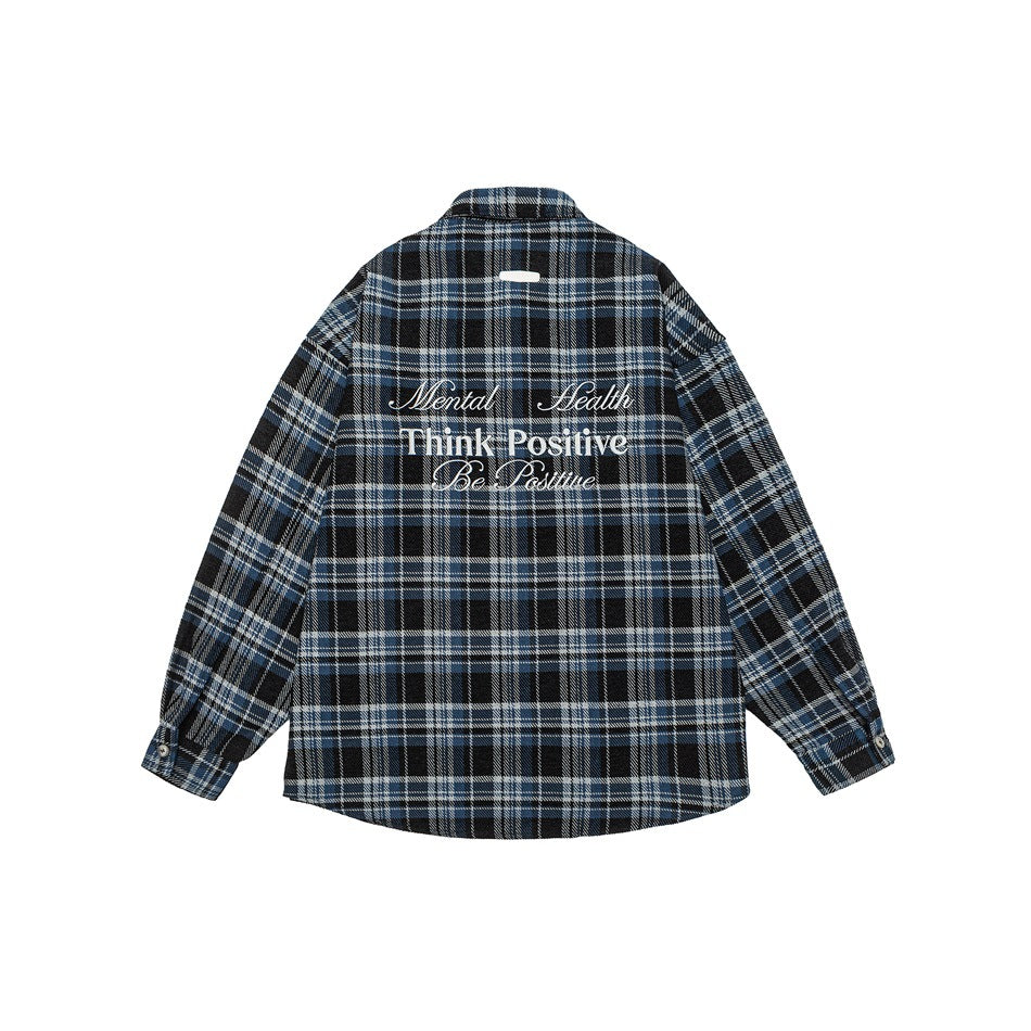 Back view of blue and black plaid long-sleeve shirt with embroidered Think Positive lettering
