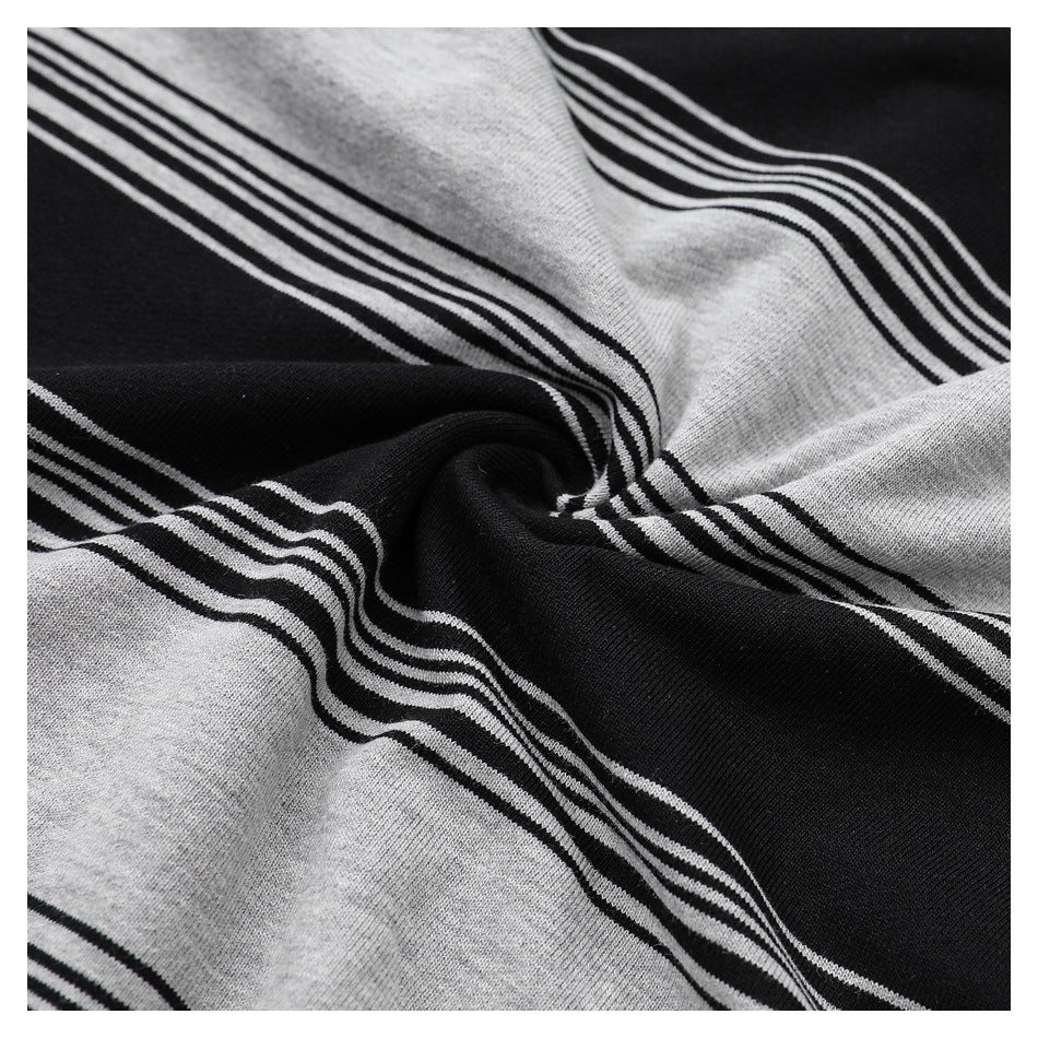 Close-up showing folds in black and heather-gray striped fabric.